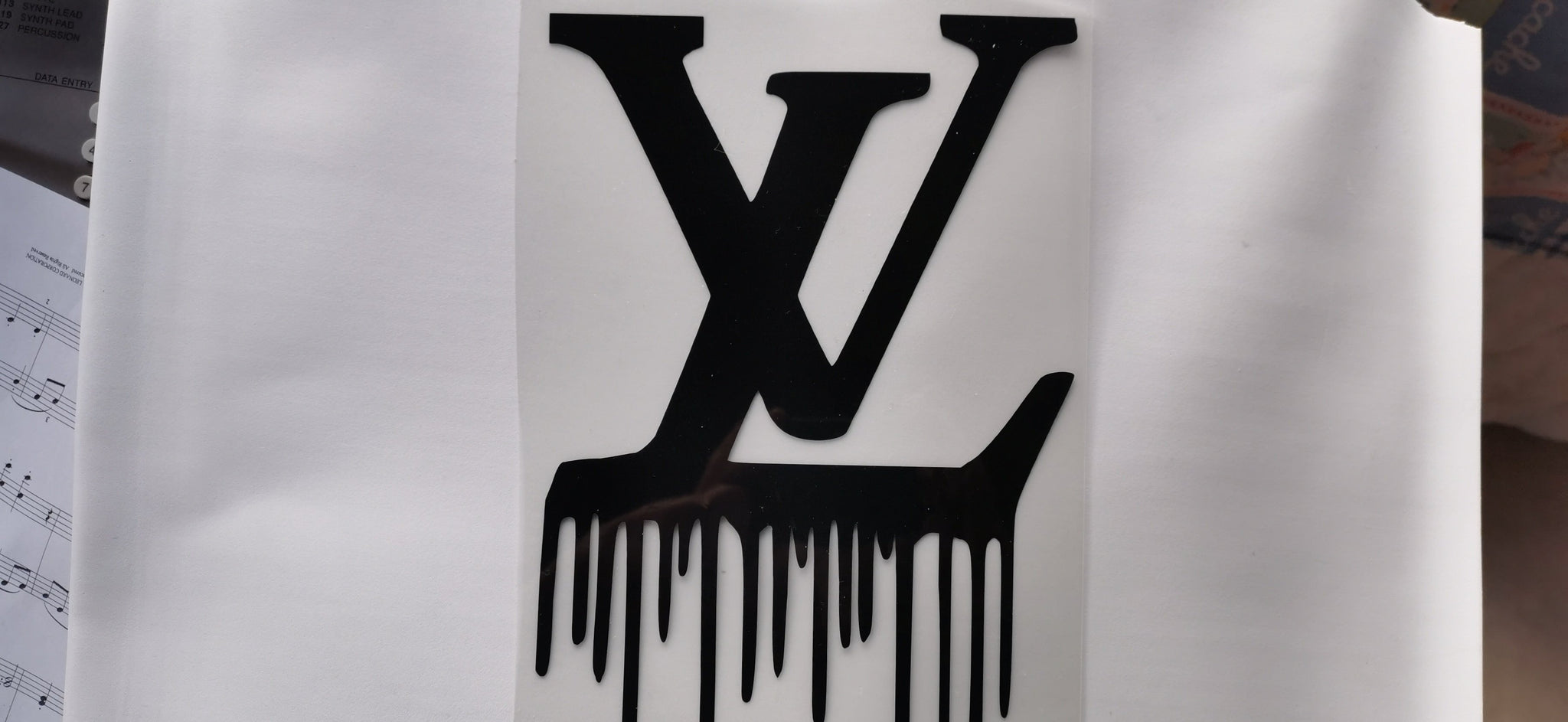 louis vuitton dripping gold logo with black background 